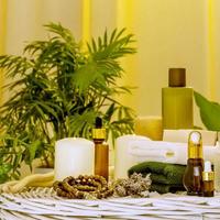 Natural beauty products, spa accessories, towels and candles in home interior photo