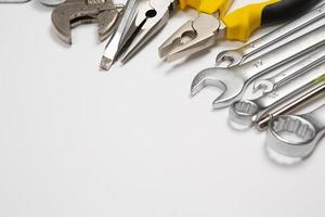 Set of tools for repair in a case on a white background. Assorted work or construction tools. Wrenches, Pliers, screwdriver. Top view photo