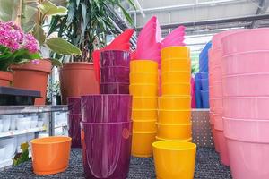 Variety of colorful flower pots in a plant store photo