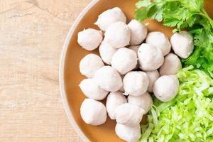 pork meatball with vegetable and spicy sauce photo