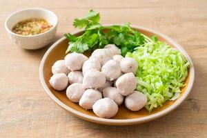 pork meatball with vegetable and spicy sauce photo