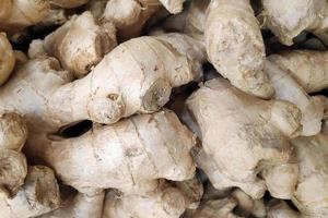 Stack of gingers on a market stall photo