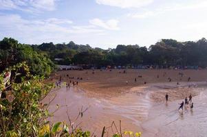 malang, indonesia, july 2022 - Balekambang beach view during the day. sunny beach weather. photo