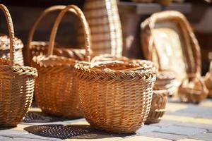 Many wicker baskets are sold. Products made of birch bark. photo