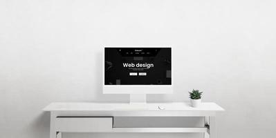 un frente ver de un computadora monitor en un oficina escritorio presentando un minimalista espacio de trabajo, destacando web diseño, ux, ui, y digital representación foto