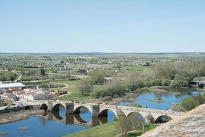 Beautiful aerial view of ancient bridge over Agueda river photo