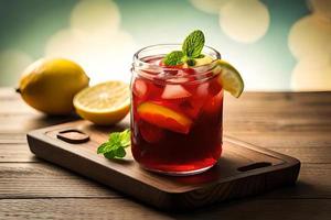 Refreshing Fruity Summer Drink on Table with Lemon and Mint photo