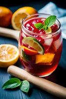 Refreshing Fruity Summer Drink on Table with Lemon and Mint photo