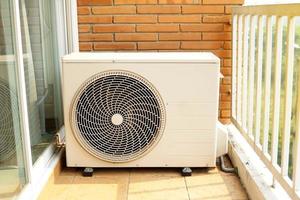 home air conditioner coil or condenser with motor installed outside the building perform cooling function. There are two types of cooling mediums, air cooled and water cooled. photo