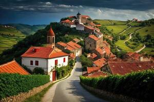 Quaint countryside village nestled among rolling hills, with red-tiled roofs and winding cobblestone streets. photo