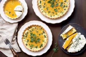 French cuisine. Cottage cheese tart with thyme in a white ceramic baking dish.Creamy soup. Creamy pumpkin pie. photo