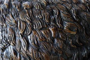 Close up Fur of Bronze Bear Statue Texture Background. photo