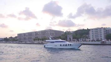 Historic buildings and yacht. City of Istanbul, Turkey. View of the historical building and yacht in the Bosphorus from the sea. video