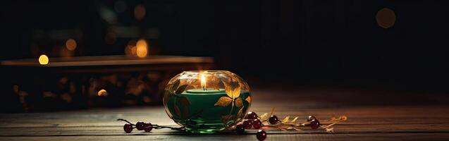 Burning candle and Christmas decoration over snow and wooden background. . photo