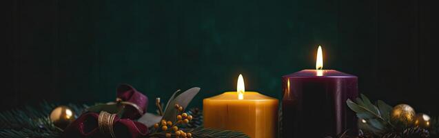 Burning candle and Christmas decoration over snow and wooden background. . photo