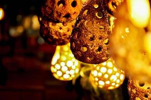 Lamp decorated like bird's nest showing by turn on light in the small pub. photo