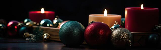 Burning candle and Christmas decoration over snow and wooden background. . photo