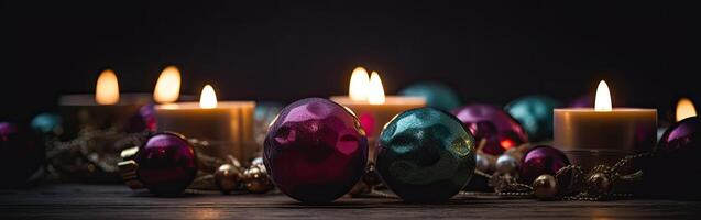 Burning candle and Christmas decoration over snow and wooden background. . photo