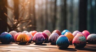 row of colorful easter eggs on wooden table and bokeh background, place for typography and logo. Rustic wooden table. Easter theme. . photo