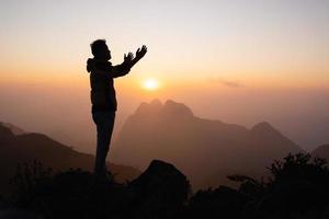 Man hands praying to god, Man Pray for god blessing to wishing have a better life. begging for forgiveness and believe in goodness, Christian Religion concept background. photo