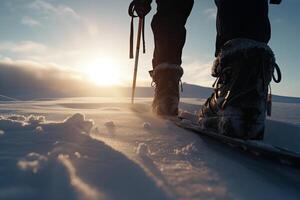 backpack in snowshoes climbs a snowy mountain, winter trekking, hiking equipment. . photo