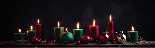 Burning candle and Christmas decoration over snow and wooden background. . photo