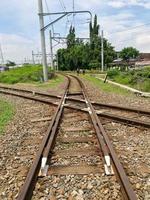 Surakarta, Indonesia, January 2023. Railroad junctions and isolated with upper-flow power grids photo