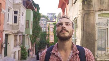 Modern young man travels. The young man visiting historical places is happy and excited. video