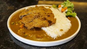 English chicken schnitzel curry with rice and good plating presentation. Thin slice of meat chicken breasts that is breaded and fried, popular dish in Germany. photo