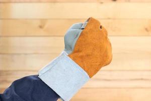 Hand in rough leather glove photo