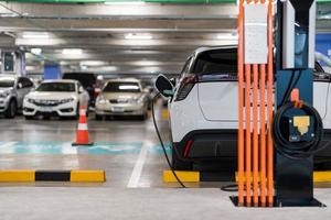 Charging of electric cars at a charging station, automotive industry, transportation photo