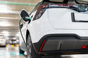 Charging of electric cars at a charging station, automotive industry, transportation photo