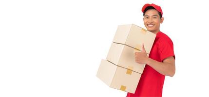 The smiling delivery man is dressed in a red cap and blank t-shirt uniform, and is standing in front of a white background photo