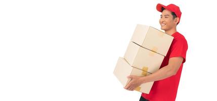 The smiling delivery man is dressed in a red cap and blank t-shirt uniform, and is standing in front of a white background photo