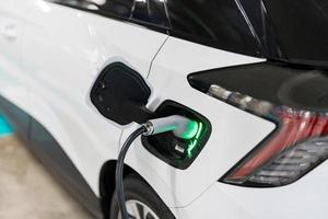 Charging of electric cars at a charging station, automotive industry, transportation photo