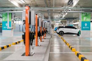 Charging of electric cars at a charging station, automotive industry, transportation photo