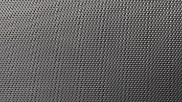 Abstract carbon fiber fabric, with black carbon fiber texture. photo