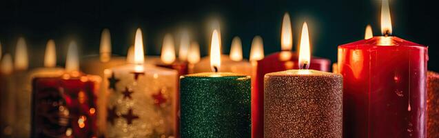 Burning candle and Christmas decoration over snow and wooden background. . photo