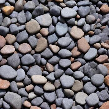 Smooth round pebbles texture background. Pebble sea beach close-up, dark wet pebble and gray dry pebble. High quality photo