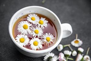 tea chamomile flowers healing hot drink healthy meal food snack on the table copy space food background rustic top view photo