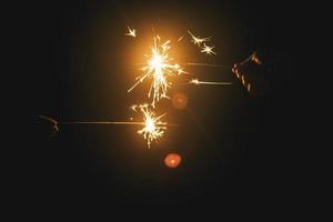 hands holding fireworks photo