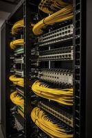 Ethernet cables and path panel in rack cabinet. photo