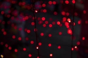 Red Defocus Abstract bokeh light effects on the night black background texture photo