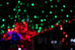 Colorful Defocus Abstract bokeh light effects on the street night black background texture wallpaper photo