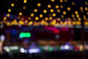 Colorful Defocus Abstract bokeh light effects on the street night black background texture wallpaper photo