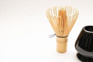 Japanese Bamboo Brush Tea Whisk or Chasen isolated on White Background. Japanese bamboo tea whisk. selective focus. photo