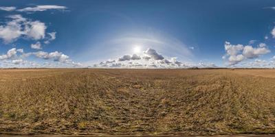 spherical 360 hdri panorama among farming field with clouds on blue sky in equirectangular seamless projection, use as sky replacement in drone panoramas, game development as sky dome or VR content photo