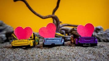 Minahasa, Indonesia  December 2022, the toy cars transporting hearts photo