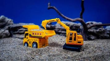 minahasa, Indonesia January 2023, toy trucks transport sand photo