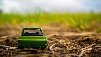 South Minahasa, Indonesia  February 2023, toy car on green grass photo